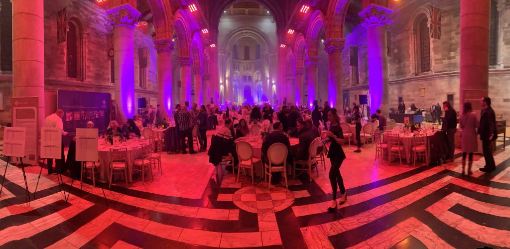 Digital Magician Noel Qualter performing at a large event in Belfast Cathedral