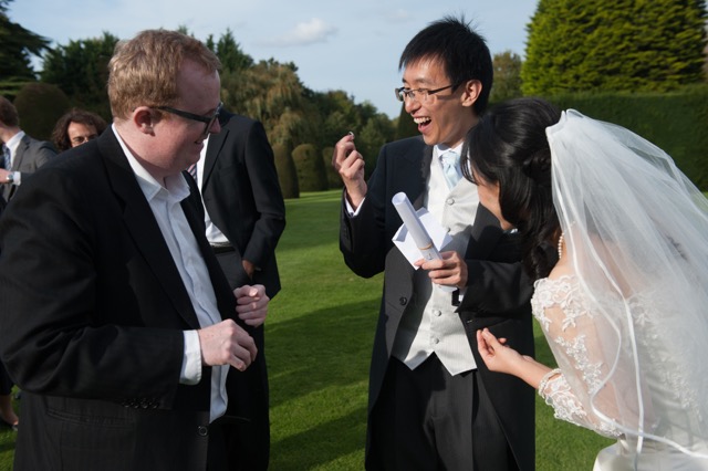 Wedding magician amazes guests at their reception