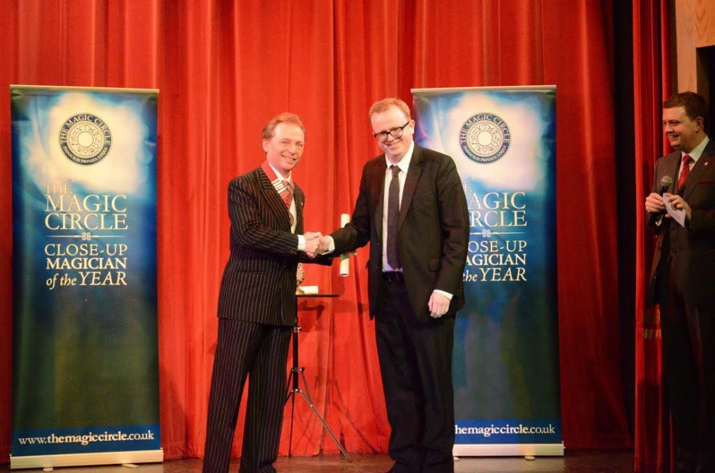 Close-up magician receiving originality award at the magic circle